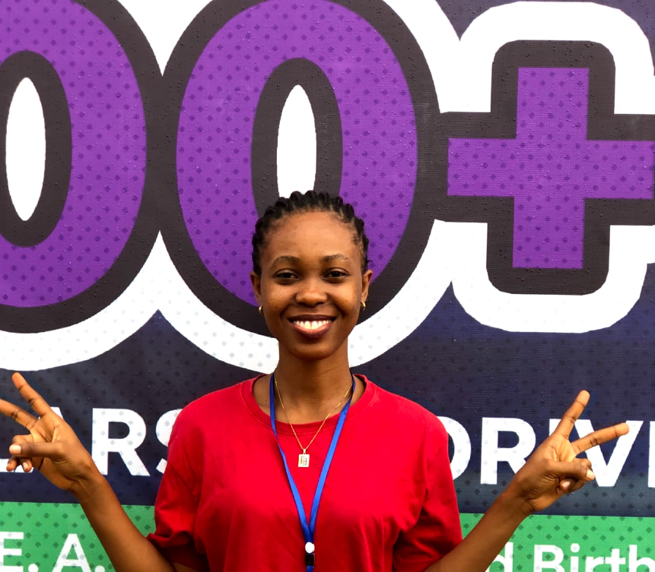 Portrait Picture of me smiling with my hands raised in a stylish way